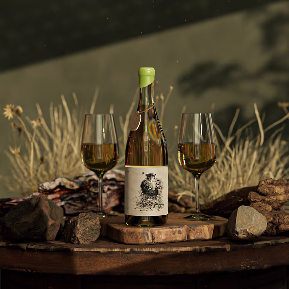 A bottle of white wine with a green cap and two matching wine glasses, arranged on a wooden surface amid desert-like foliage and rocks. 3D MADE BY TONE SEGURADO